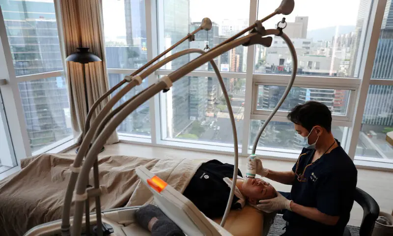 Cindy Gu from the US receives skin care at Lienjang Clinic in Seoul, South Korea. -- Reuters