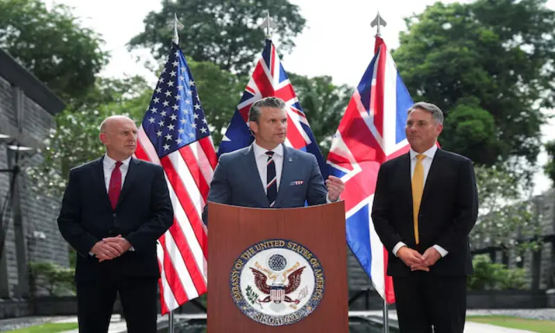 Australian Defence Minister Richard Marles and British Defence Secretary John Healey look on as US Secretary of Defence Pete Hegseth speaks during an AUKUS Defence Ministers' press huddle at the US Embassy in Singapore, on May 30, 2026. Reuters Australian Defence Minister Richard Marles and British Defence Secretary John Healey look on as US Secretary of Defence Pete Hegseth speaks during an AUKUS Defence Ministers' press huddle at the US Embassy in Singapore, on May 30, 2026. Reuters
