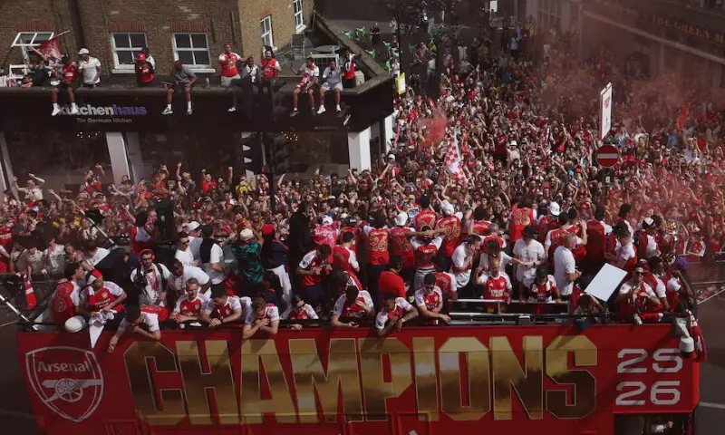 A general view as Arsenal players and fans celebrate during the victory parade in London. -- Reuters