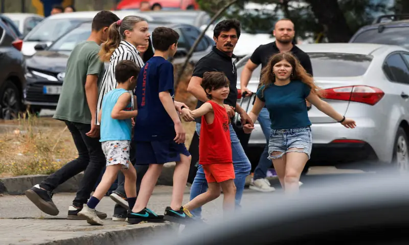 People, including children, walk along a road, as they make their way while fleeing the southern suburbs of Beirut, after Israeli Prime Minister Benjamin Netanyahu ordered the military to attack targets in the suburbs, Lebanon. -- Reuters