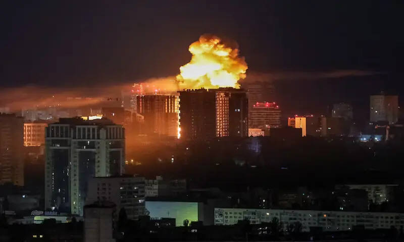 An explosion lights up the sky over the city during a Russian missile and drone strike in Kyiv, Ukraine, on Tuesday. -- Reuters