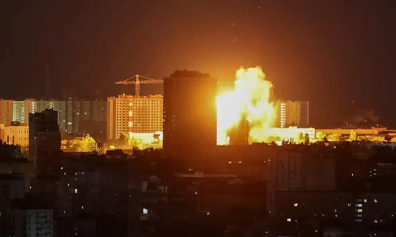 An explosion lights up the sky over the city during a Russian missile and drone strike in Kyiv, Ukraine, on Tuesday. -- Reuters