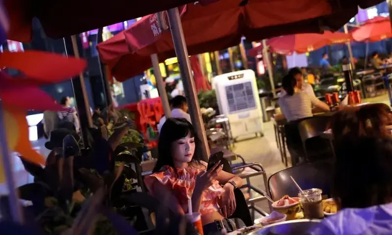 Customers dine at a restaurant in a shopping area of Beijing, China. -- Reuters