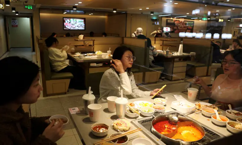Customers dine at the Hailao Huoguo in Beijing, China. -- Reuters file