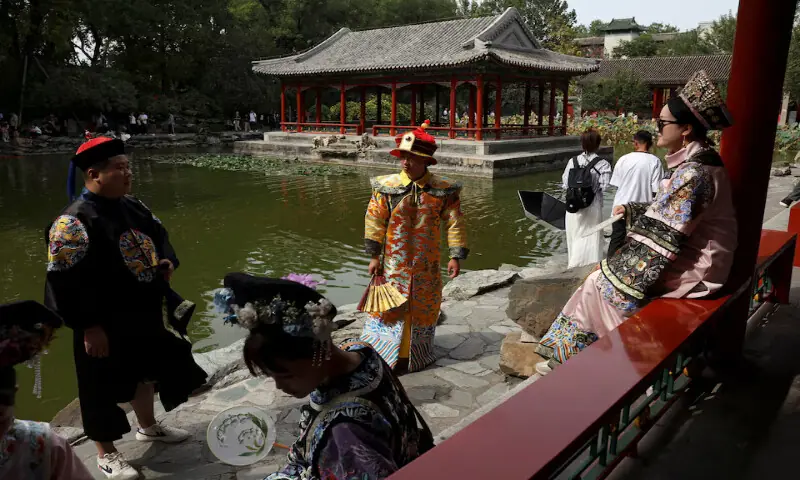 Tourists wearing Qing dynasty costumes visit Prince Kung's Mansion in Beijing, China. -- Reuters file