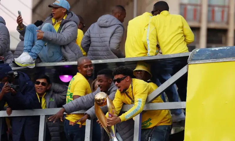 Mamelodi Sundowns' Ronwen Williams and Teboho Mokoena celebrate with the trophy during the victory parade. -- Reuters Mamelodi Sundowns' Ronwen Williams and Teboho Mokoena celebrate with the trophy during the victory parade. -- Reuters