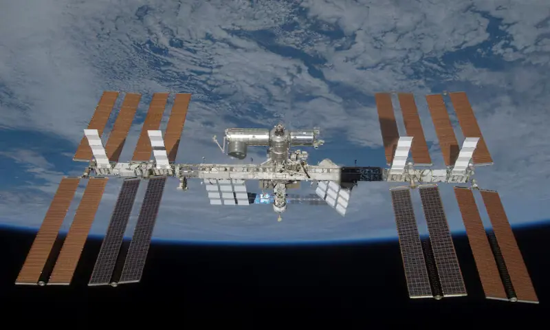 The International Space Station is seen with its full complement of solar arrays from the Space Shuttle Discovery. -- Reuters