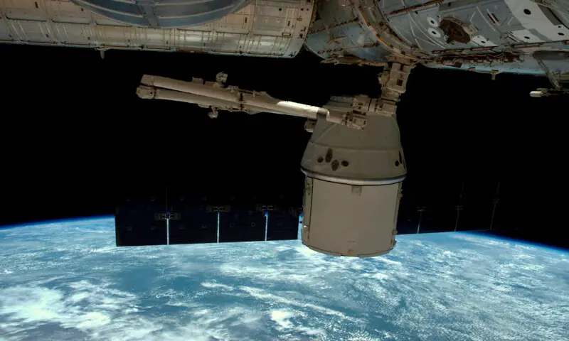 A NASA photo shows a SpaceX Dragon capsule as it is released from the International Space Station. -- Reuters