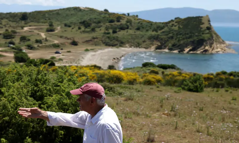 Kostaq Konomi, who claims to be one of the owners of the land where a luxury resort is planned by a company linked to Donald Trump's son-in-law, Jared Kushner looks on at the bay of the Vjosa-Narta Protected Area, in Zvernec near Vlora, Albania. -- Reuters