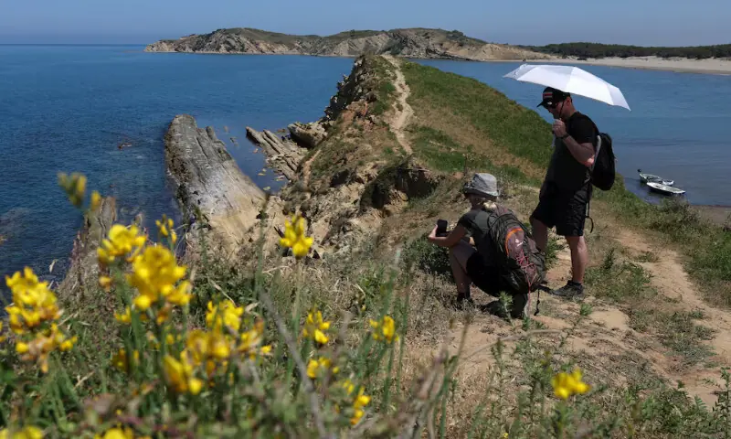 Tourists at the bay at the Vjosa-Narta Protected Area, where a luxury resort is planned by a company linked to Donald Trump's son-in-law, Jared Kushner, in Zvernec near Vlora, Albania. -- Reuters