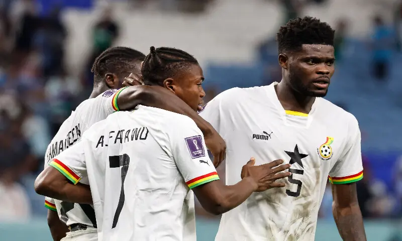 Ghana's forward #07 Abdul Fatawu Issahaku and Ghana's midfielder #05 Thomas Partey react at the end of the Qatar 2022 World Cup Group H football match between Ghana and Uruguay at the Al-Janoub Stadium in Al-Wakrah, south of Doha on December 2, 2022. AFP