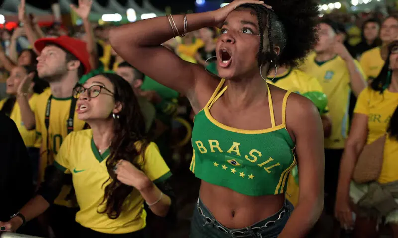 Brazil fans react while watching the match on a giant TV screen on Copacabana beach in Rio de Janeiro. -- Reuters