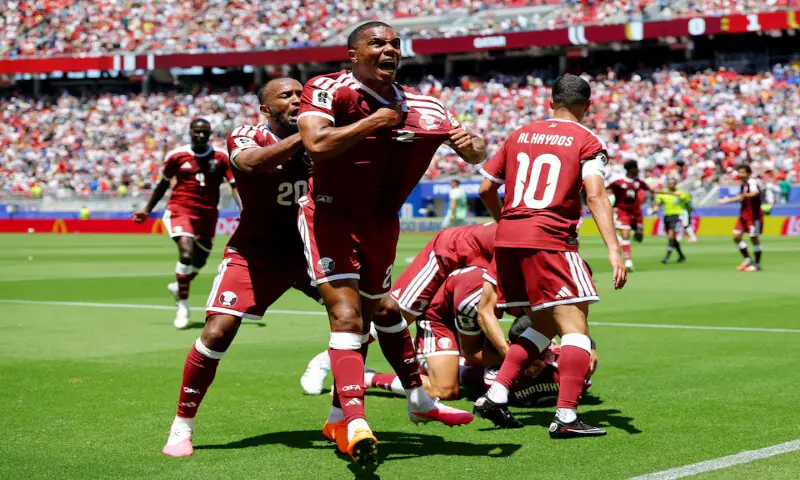 Qatar's Pedro Miguel and Ahmed Fathy celebrate after Boualem Khoukhi scored their first goal against Switzerland in their World Cup clash in California, US. -- Reuters Qatar's Pedro Miguel and Ahmed Fathy celebrate after Boualem Khoukhi scored their first goal against Switzerland in their World Cup clash in California, US. -- Reuters