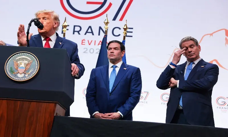 US Secretary of State Marco Rubio (centre) and Treasury Secretary Scott Bessent (right) look on as President Donald Trump speaks at a press conference during the G7 Leaders' Summit in Evian-les-Bains, France, on June 17, 2026. AFP