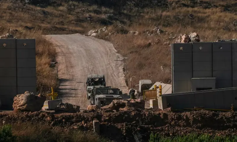 Israeli military vehicles at the Israel-Lebanon border, as seen from the Israeli side. -- Reuters