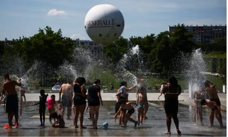 People play in a fountain at the Andre Citroen park as temperatures rise in Paris during a second heatwave affecting a large part of France. -- Reuters People play in a fountain at the Andre Citroen park as temperatures rise in Paris during a second heatwave affecting a large part of France. -- Reuters