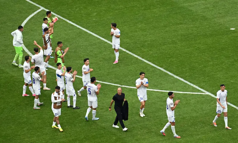 Uzbekistan players applaud their fans after the match against Portugal. -- Reuters