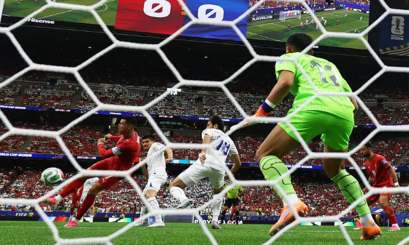 Portugal's Cristiano Ronaldo scores the first goal against Uzbekistan in the World Cup match in Houston Stadium, Houston, Texas. -- Reuters