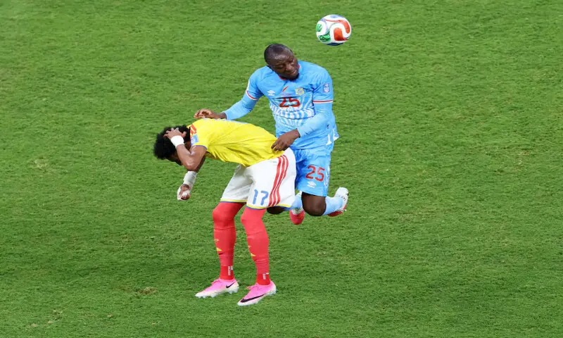 DR Congo's Edo Kayembe in action with Colombia's Johan Mojica. -- Reuters