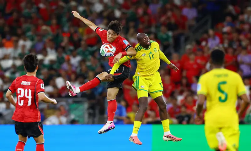 South Korea's Park Jin-Seop in action with South Africa's Evidence Makgopa. -- Reuters