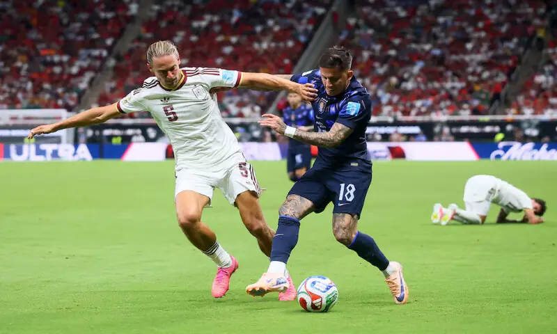 Spain's Marcos Llorente in action with Uruguay's Brian Rodriguez. -- Reuters