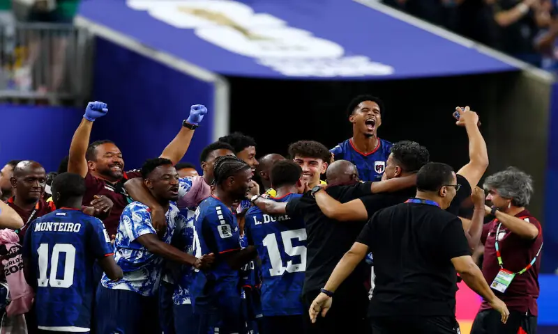 Cape Verde players celebrate after the match as Cape Verde qualify for the knockout stages of the World Cup. -- Reuters