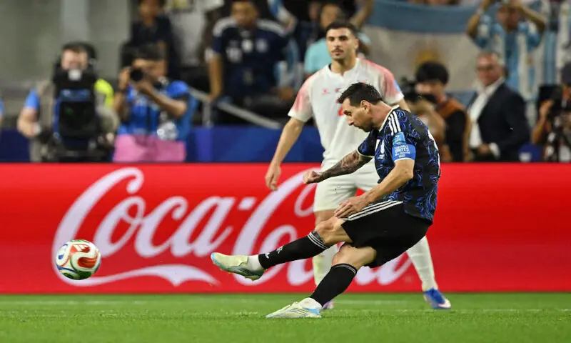 Argentina's Lionel Messi scores their third goal from a free kick. -- Reuters