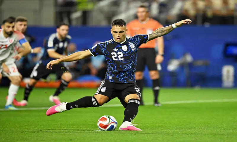 Argentina's Lautaro Martinez scores their second goal from the penalty spot. -- Reuters