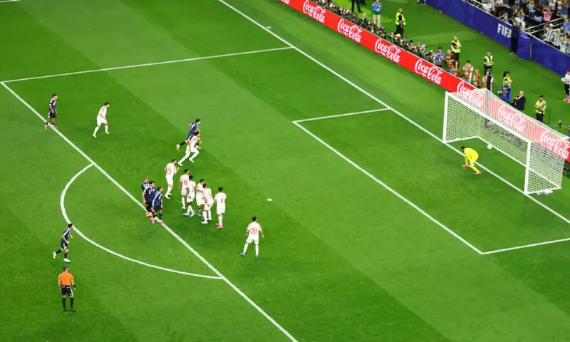 Argentina's Lionel Messi scores their third goal from a free kick past Jordan's Yazeed Abulaila. -- Reuters