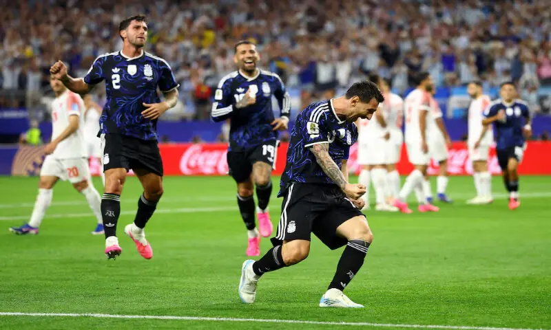 Argentina's Lionel Messi celebrates scoring their third goal. -- Reuters