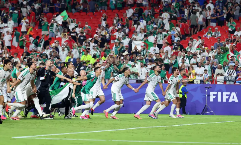 Algeria players celebrate after the match. -- Reuters