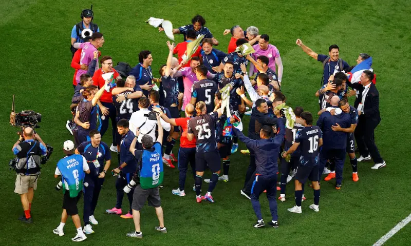 Paraguay players and staff celebrate. -- Reuters