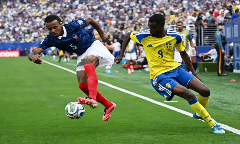 France's Jules Kounde in action with Sweden's Alexander Isak. -- Reuters