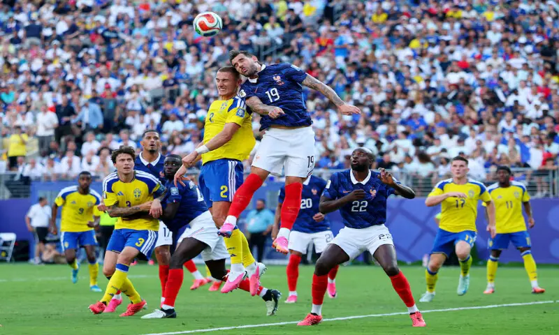 France's Theo Hernandez in action with Sweden's Gustaf Lagerbielke. -- Reuters