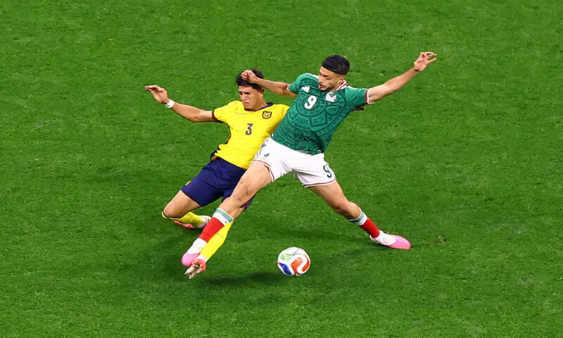Mexico's Raul Jimenez in action with Ecuador's Piero Hincapie. -- Reuters