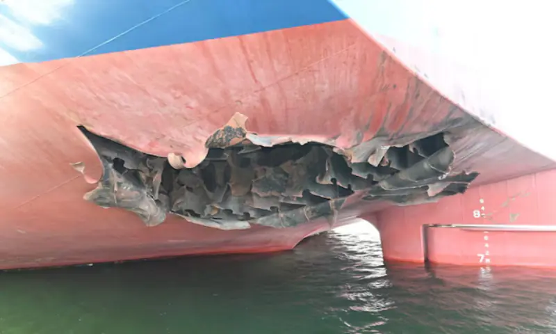 The damaged stern of a bulk carrier operated by South Korean shipper HMM, after it was struck by two unidentified objects on May 4 while stranded in the Strait of Hormuz. -- Reuters