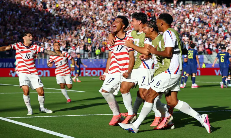 Malik Tillman of the US celebrates scoring their second goal with teammates. -- Reuters