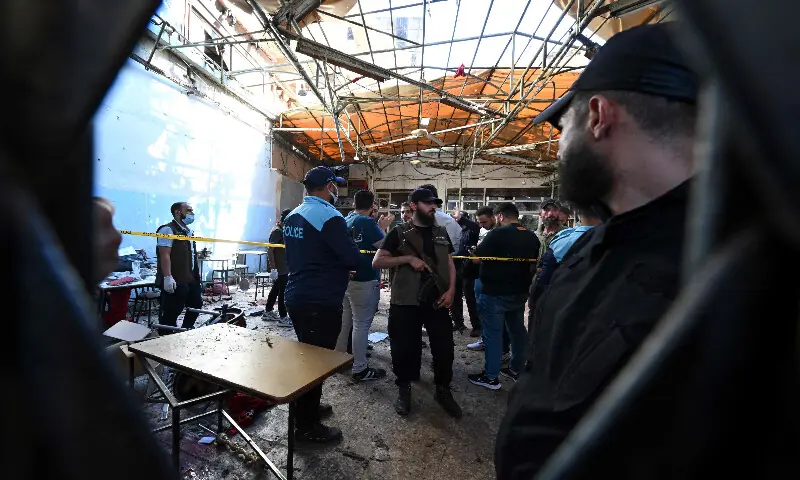 Syrian security forces gather at the site of an explosion at a cafe in Damascus on July 2, 2026. AFP