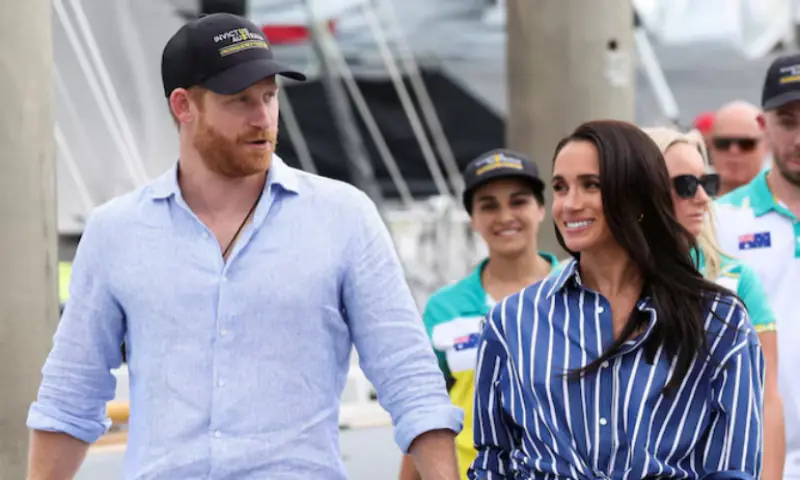 Britain's Prince Harry and Meghan, the Duke and Duchess of Sussex, arrive at Rushcutters Bay following a sail on Sydney Harbour with veterans from the Invictus Australia community, in Sydney, Australia. -- Reuters