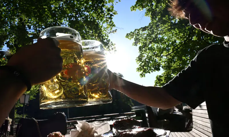 People enjoy the warm weather at the English Garden in Munich, Germany. -- Reuters
