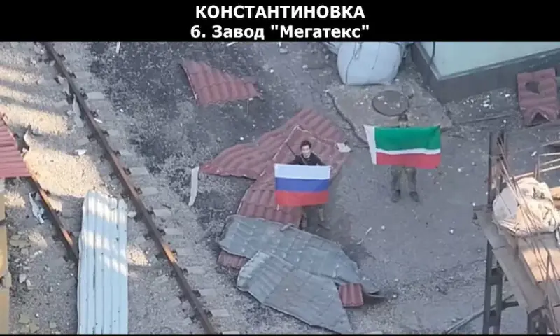 A drone view shows soldiers holding up a Russian and Chechen Republic flags as the Russian defence ministry says its forces had taken control of Kostiantynivka in the Donetsk region, Ukraine. -- Reuters