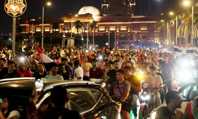 Egypt fans celebrate in the streets of Cairo after the match as Egypt defeat Australia. -- Reuters