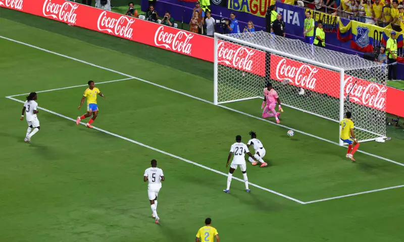 Ghana's Lawrence Ati Zigi in action with Colombia's Luis Suarez. -- Reuters