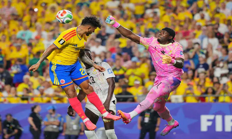 Ghana's Lawrence Ati Zigi in action with Colombia's Luis Suarez. -- Reuters