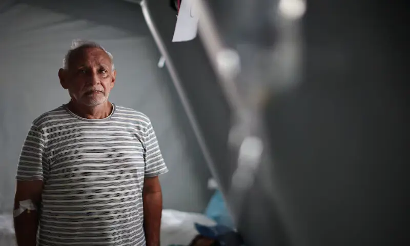 Juan Zapata poses for a photo at a field hospital in La Guaira, Venezuela. -- Reuters