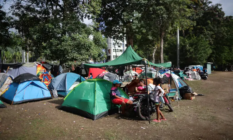 Displaced people shelter at a temporary camp in La Guaira, Venezuela. -- Reuters