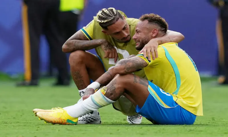 Brazil's Neymar and Raphinha look dejected after the match as Brazil are eliminated from the World Cup. -- Reuters