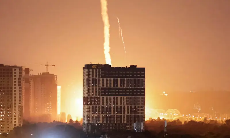 An explosion lights up the sky over the city during a Russian missile and drone strike in Kyiv, Ukraine, on Monday. -- Reuters