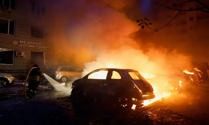 A firefighter works at the site of residential apartment buildings which were heavily damaged during Russian missile and drone strikes in Kyiv, Ukraine, on Monday. -- Reuters