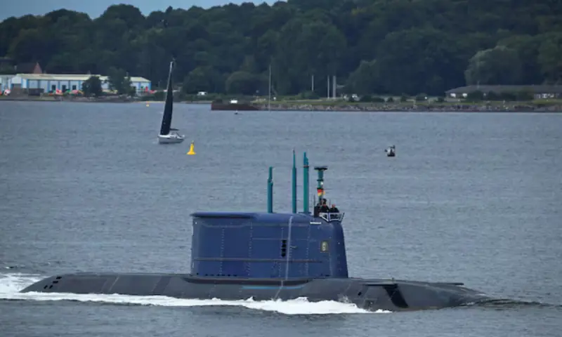 A submarine, built by ThyssenKrupp Marine Systems company, moves through the water on the Kiel Fjord, heading toward the Baltic Sea, off the coast of Kiel, Germany. -- Reuters